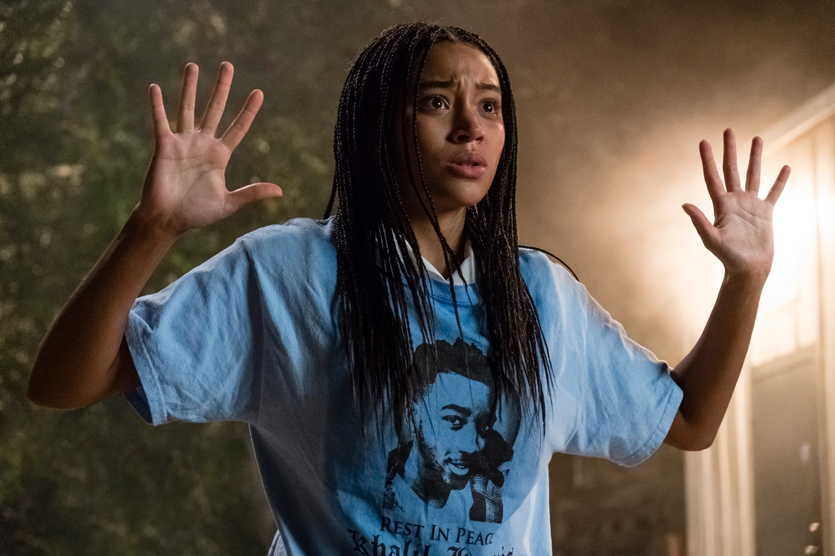 Amandla Stenberg with her hands in the air, from a scene in The Hate U Give.